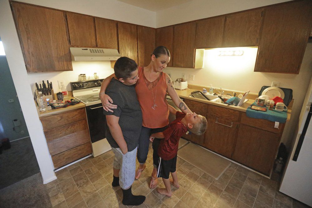 Misty Dotson Hugging Kids via AP